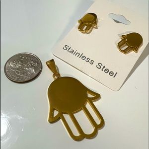 Never worn. Gold tone Stainless Steel hand charm and earrings